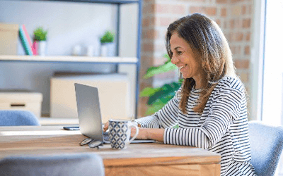 A woman sitting in front of a computer.