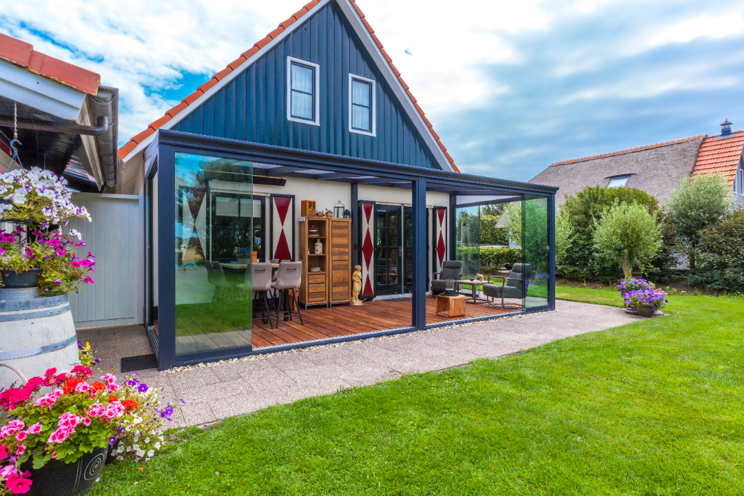 Stunning modern glass veranda by Deponti, perfect for outdoor dining or a cozy sitting area. Transform your garden with a stylish, functional extension.